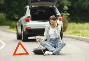 Woman calling roadside assistance